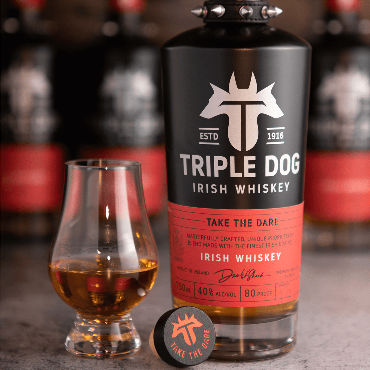 Bottle of Triple Dog Irish Whiskey with a glass and coaster, featuring unique blend and smooth taste profile.