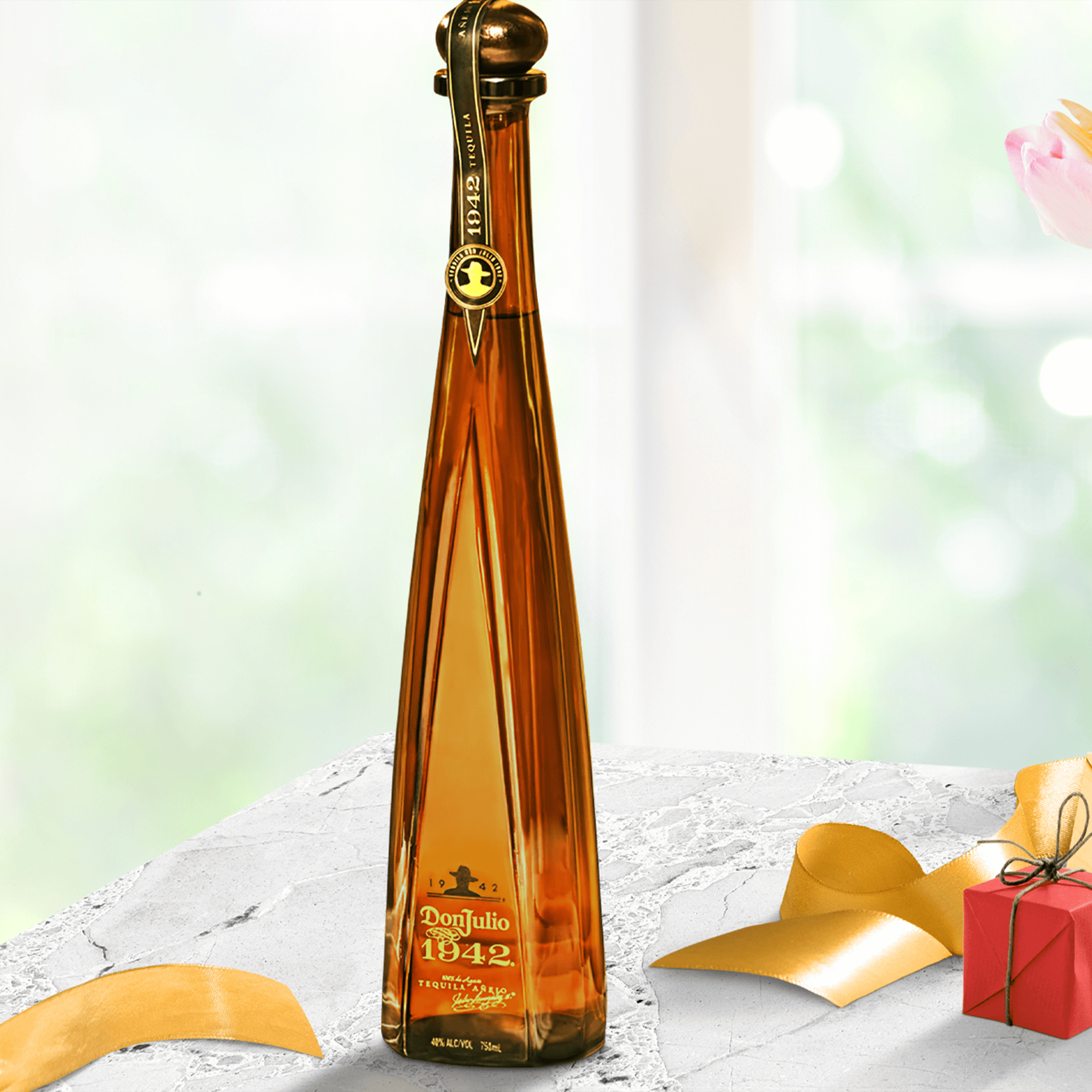 Don Julio Añejo 1942 Tequila bottle on a marble surface, showcasing its elegant design and rich amber color.