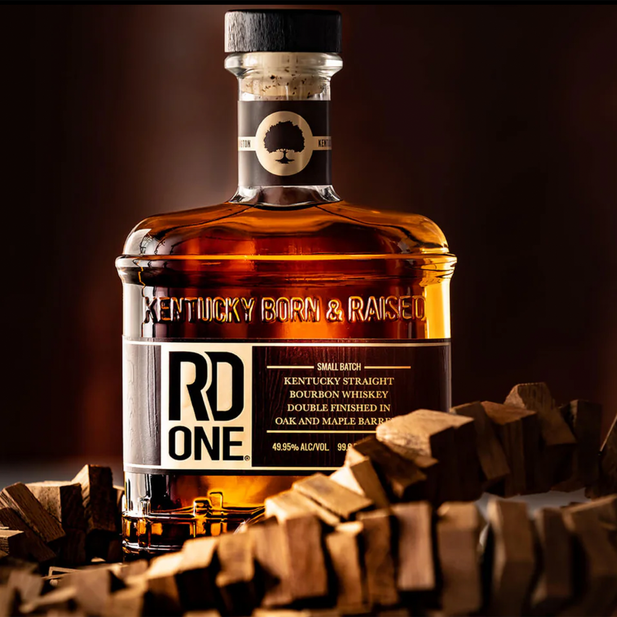 RD1 Double Oak & Maple Bourbon whiskey bottle with wooden staves, featuring 'Kentucky Born & Raised' label.