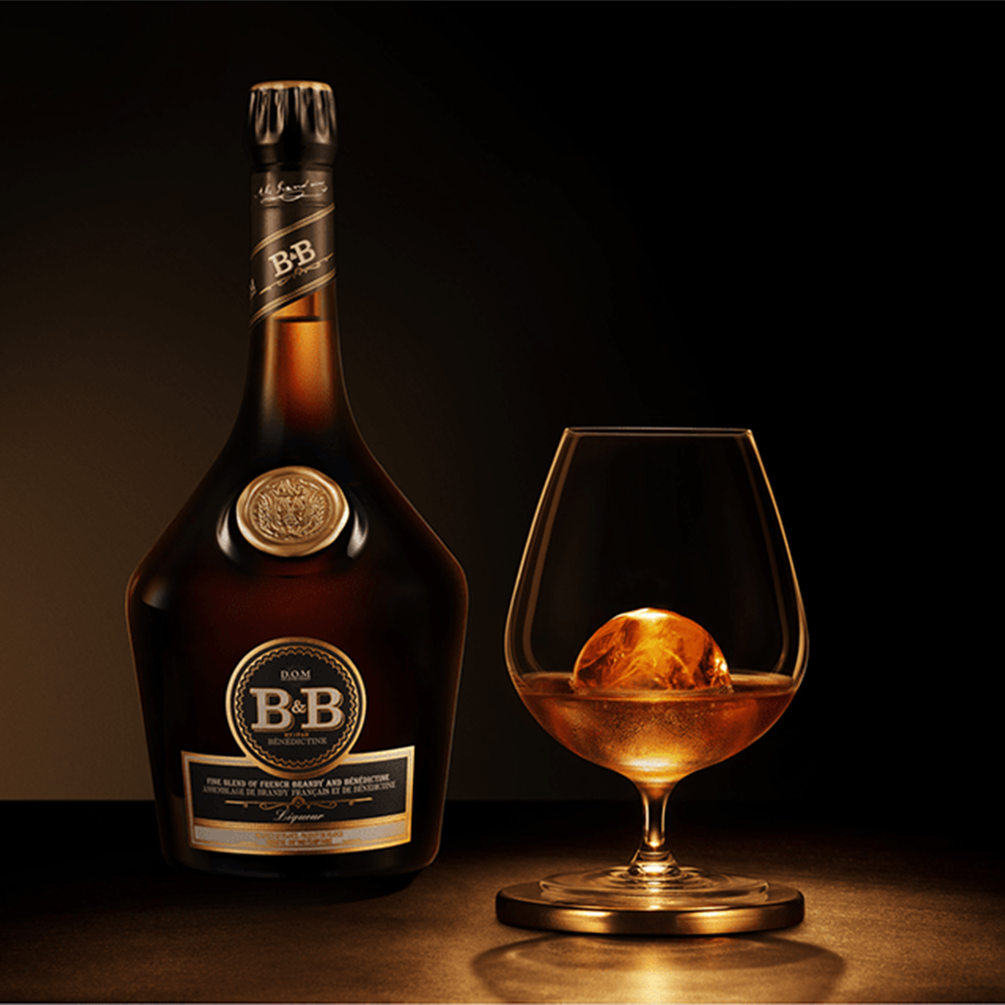 B&B Benedictine Brandy Liqueur bottle next to a glass with whiskey ice ball on a dark background.