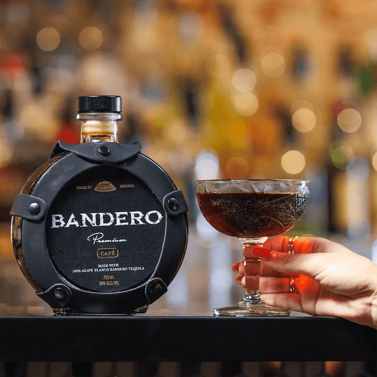 Bandero Premium Café Tequila liqueur bottle with a cocktail, featuring notes of coffee, chocolate, and vanilla. 70 Proof.