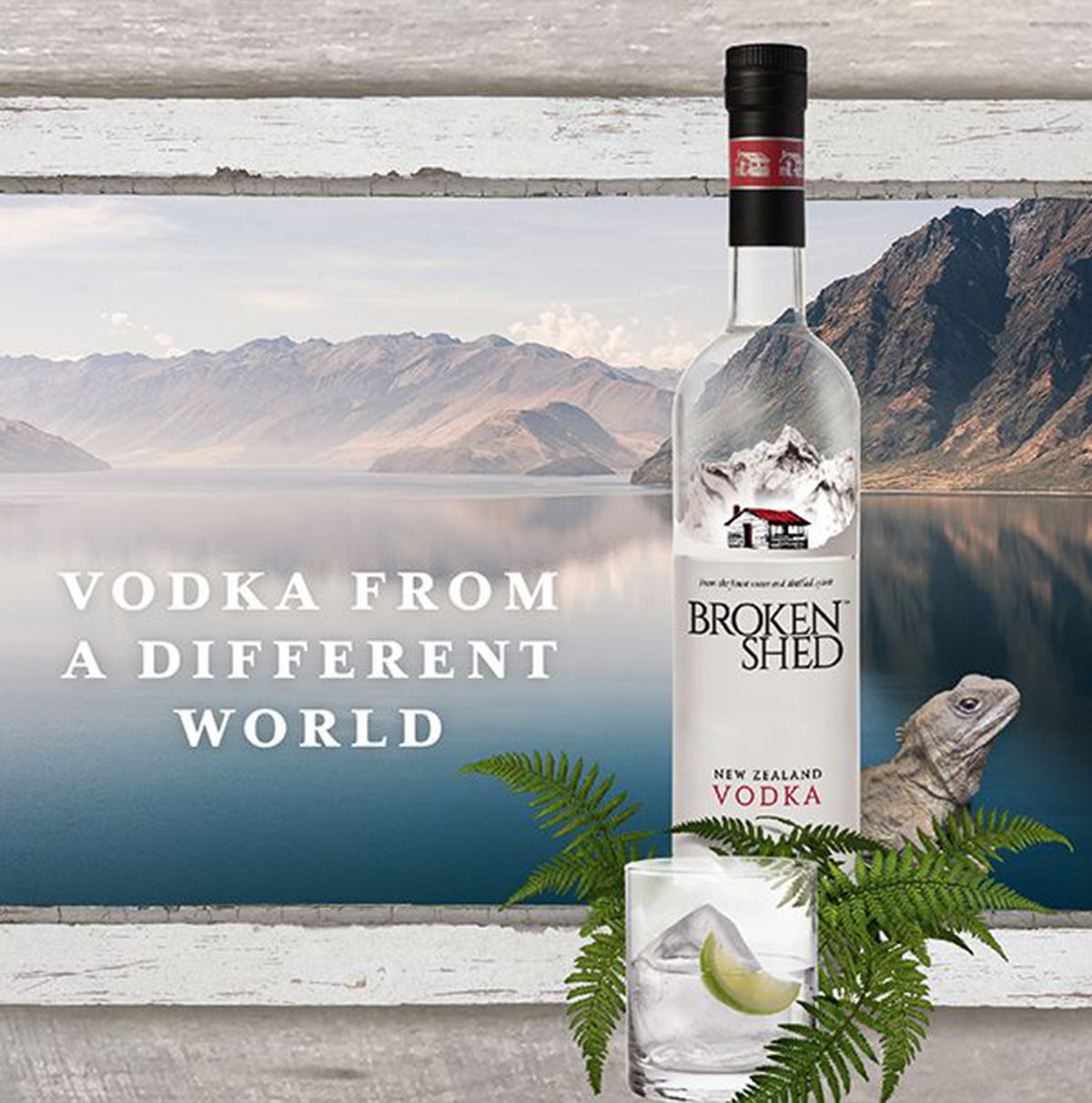 Broken Shed Vodka 1.75L bottle with fresh lime and fern, set against a scenic New Zealand landscape.