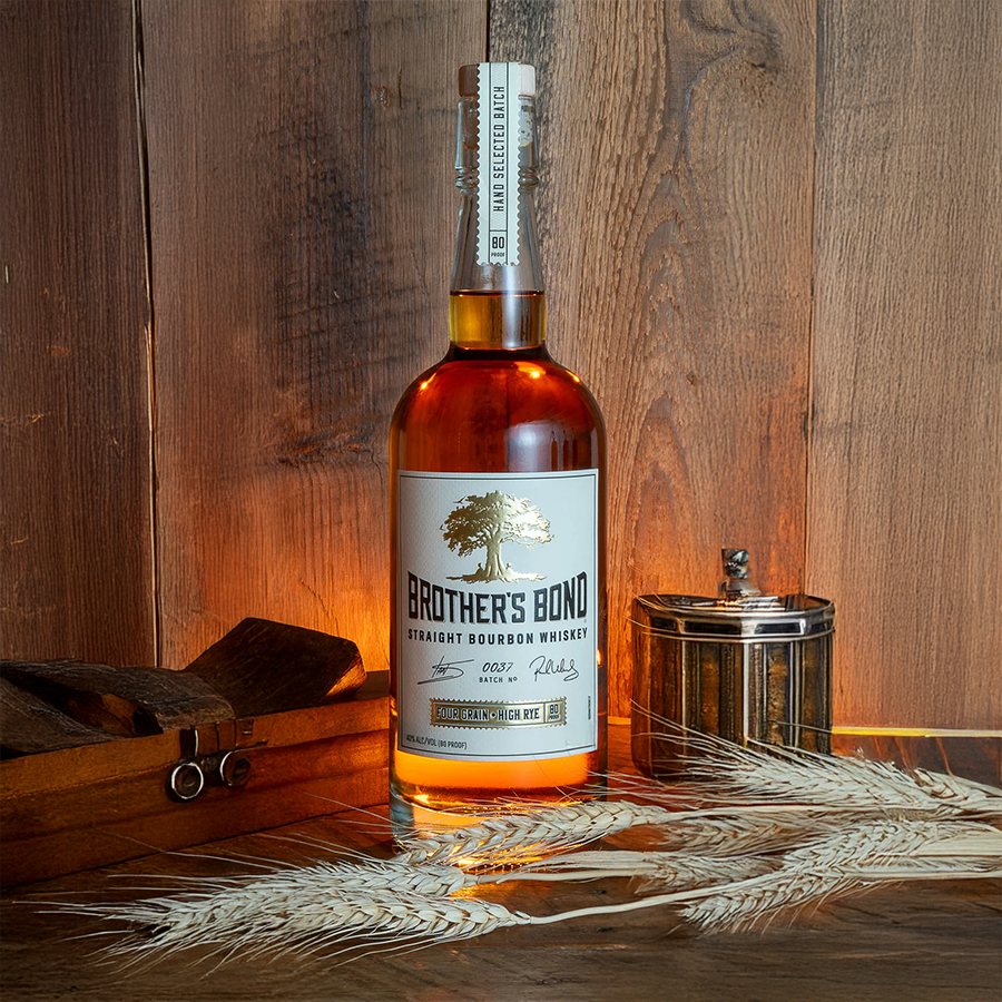 Brother's Bond Straight Bourbon 375ml bottle on a wooden background with rustic decor.