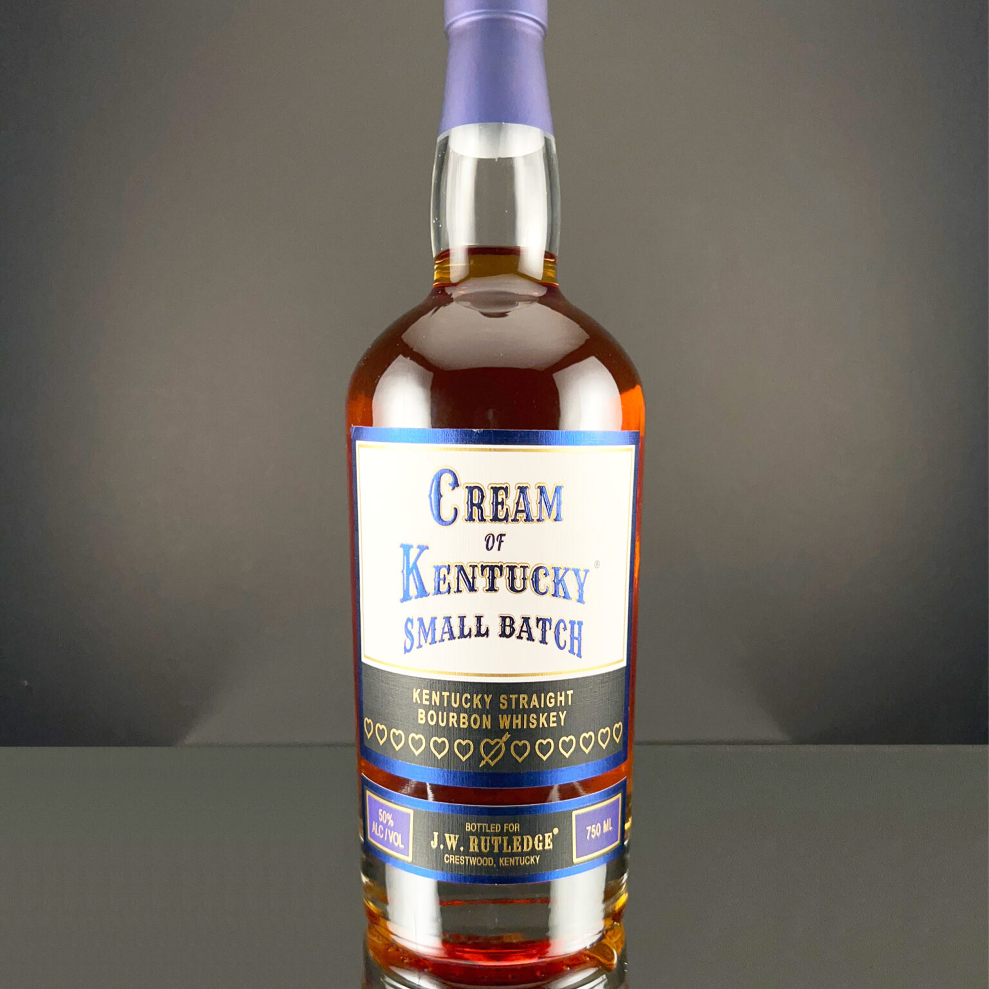 Cream of Kentucky Small Batch Straight Bourbon whiskey bottle with vintage label design.