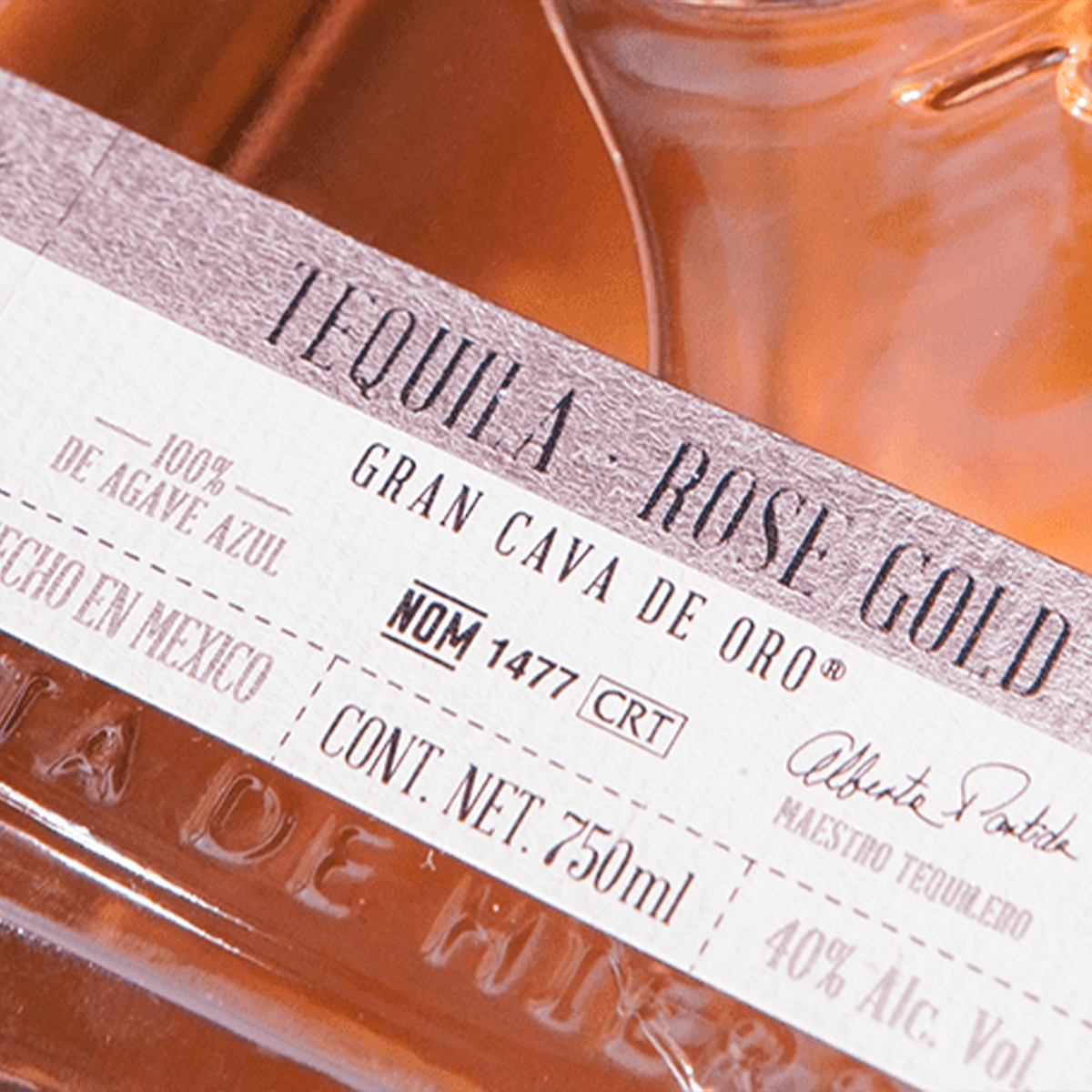 Cava de Oro Rose Gold Tequila bottle label showcasing 750ml size and 40% ABV details.