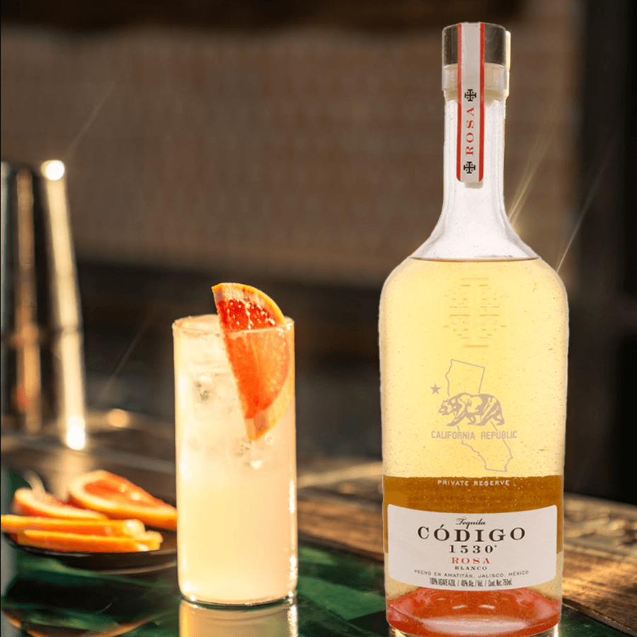 Código 1530 Rosa tequila bottle with a refreshing cocktail, showcasing its unique rosé hue and premium quality.