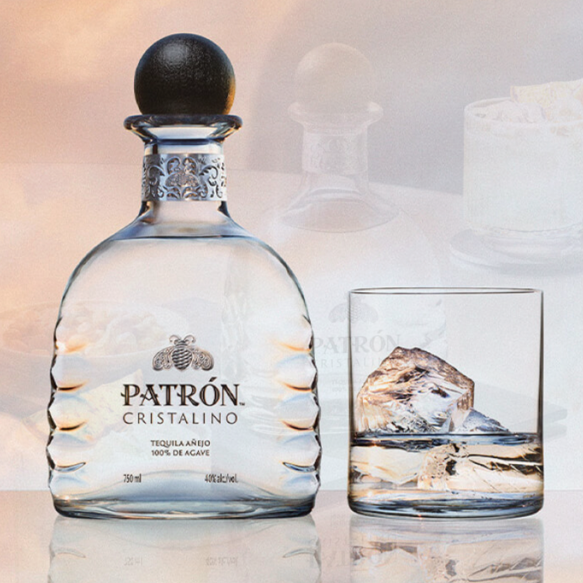 Patrón Cristalino Añejo tequila bottle with glass and ice, showcasing its ultra-premium quality and craftsmanship.