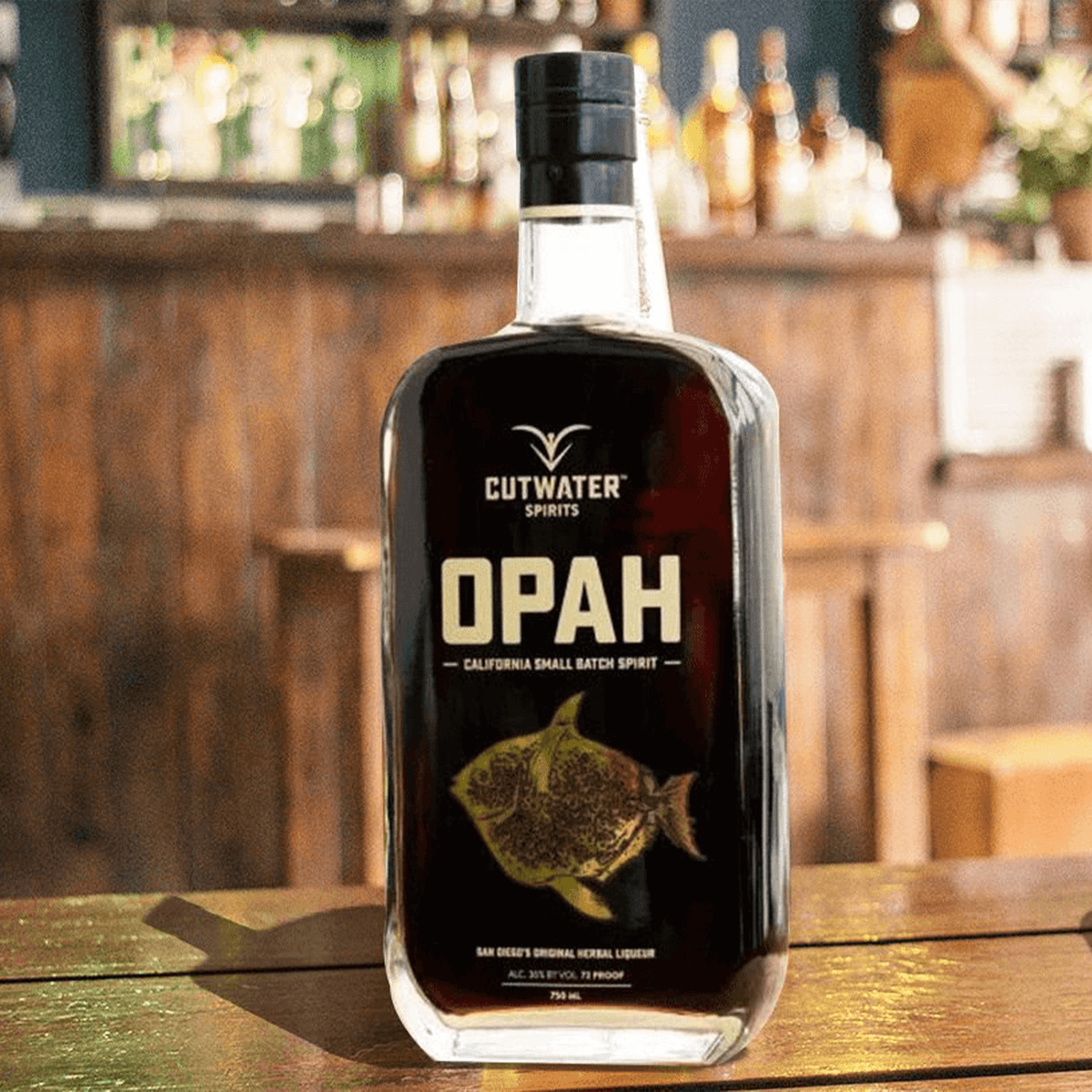Cutwater Opah herbal liqueur bottle showcasing warm licorice flavors for festive toasts, 72 proof.