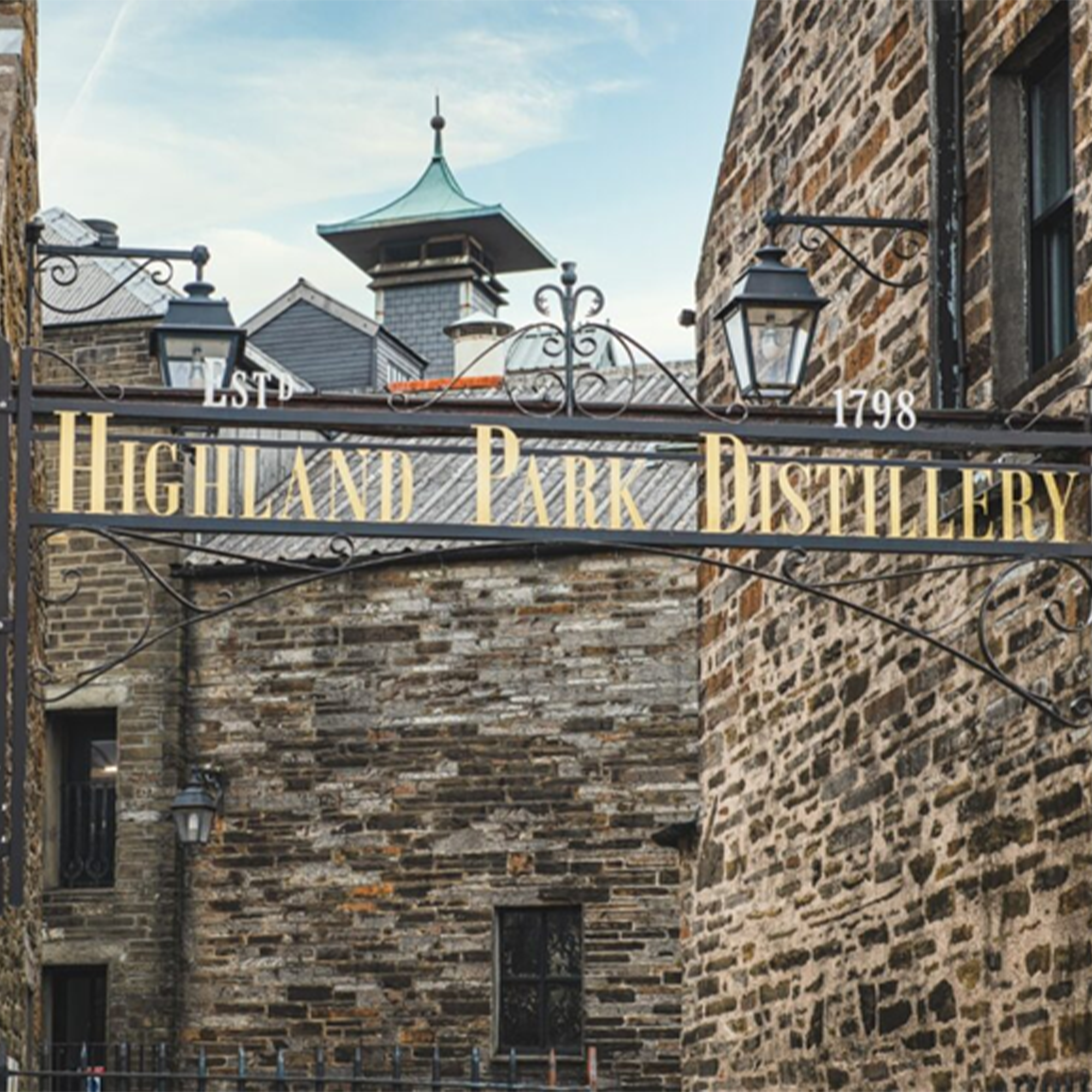 Entrance sign of Highland Park Distillery, established in 1798, showcasing its historic architecture.