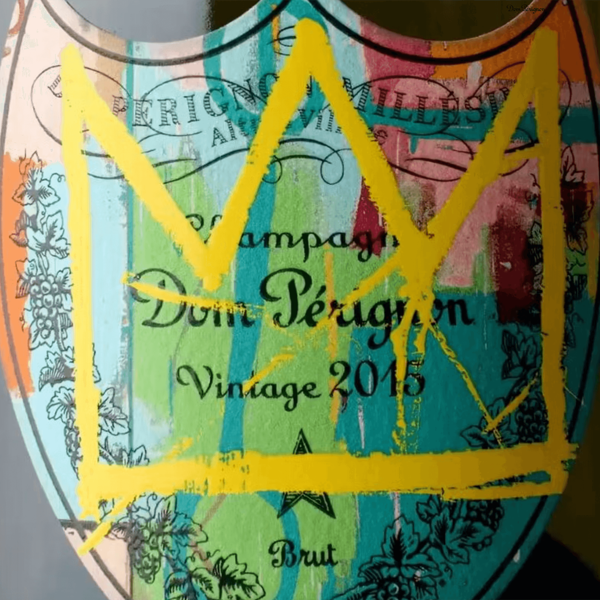 Dom Pérignon Vintage 2015 label featuring Jean-Michel Basquiat's artwork with a colorful crown design.