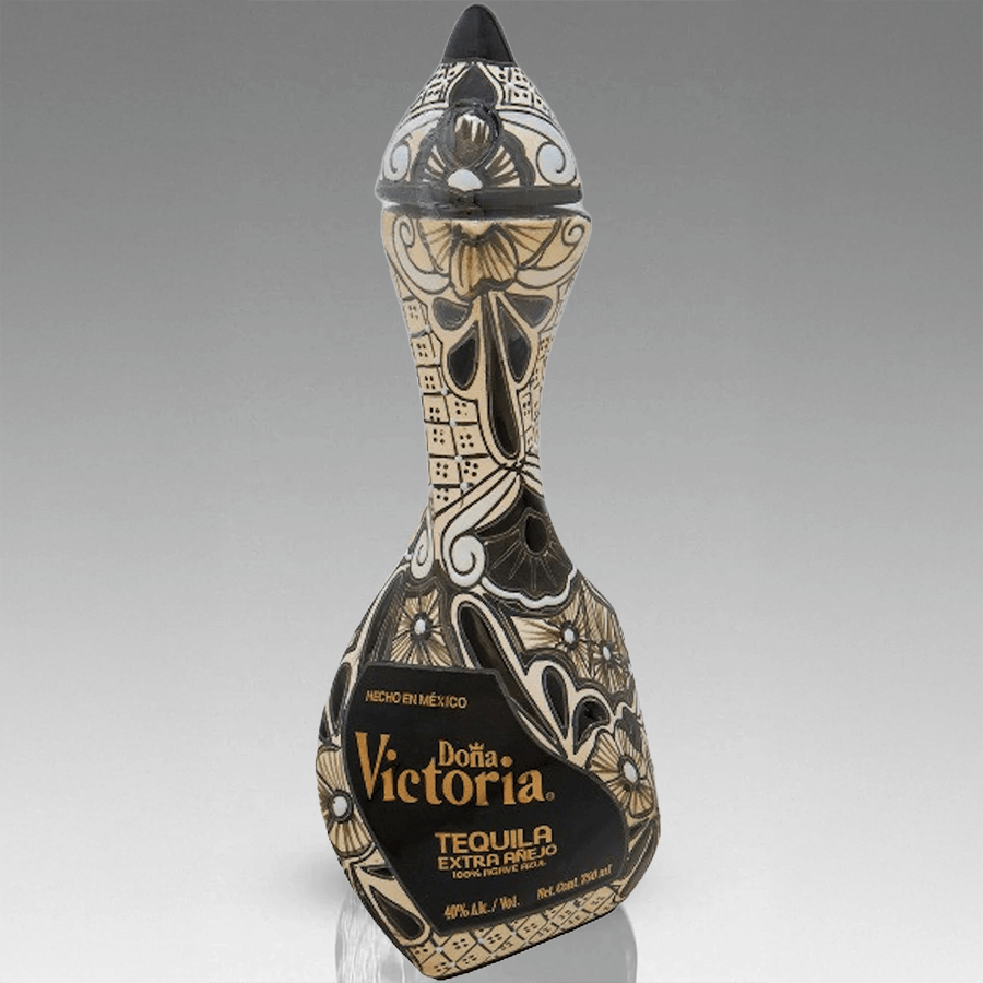 Doña Victoria Extra Añejo Black Tequila bottle with intricate design showcasing artisanal craftsmanship.