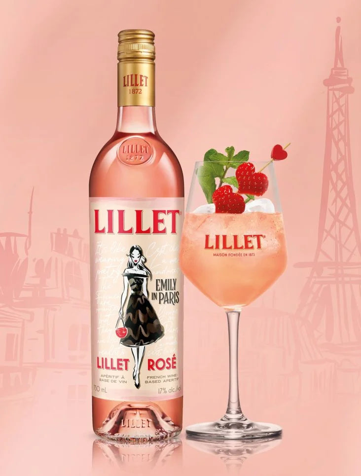 Lillet Aperitif Rosé Emily in Paris limited edition bottle and cocktail with raspberries on a pink background.