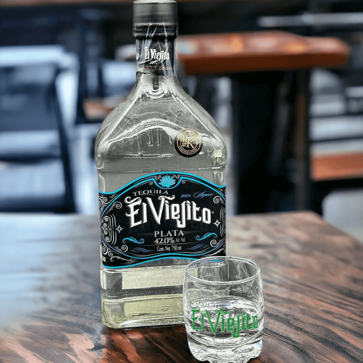 Bottle of El Viejito Plata Tequila with a shot glass, showcasing premium tequila from Jalisco.