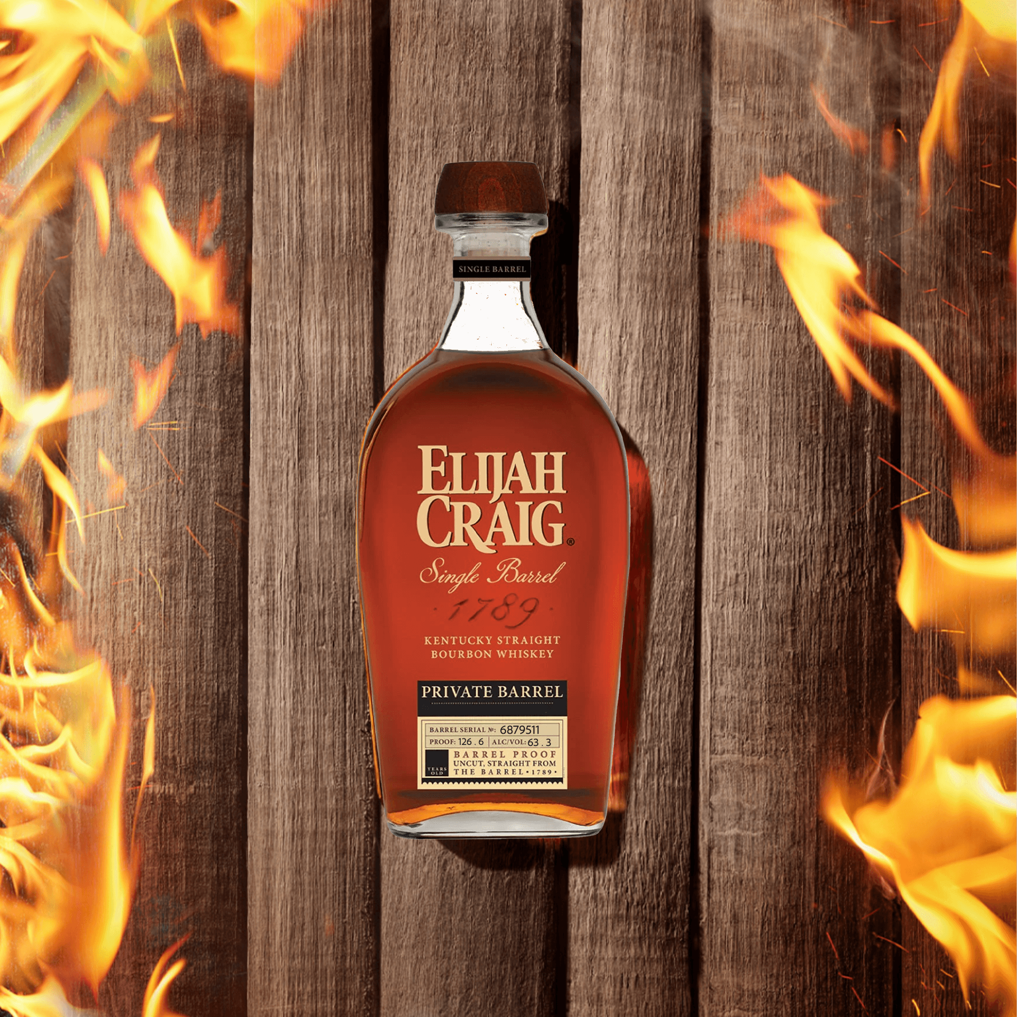 Elijah Craig Private Barrel 9 Year Bourbon Whiskey bottle surrounded by flames on a wooden background.