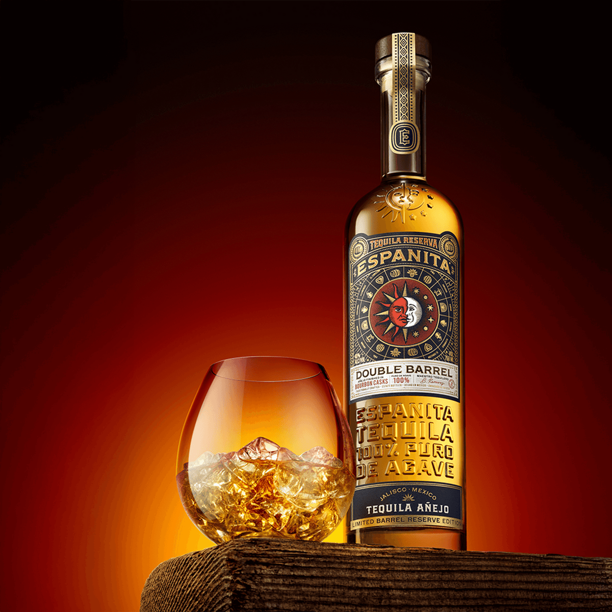 Espanita Double Barrel Añejo Tequila bottle with glass and ice, showcasing rich amber color and elegant packaging.