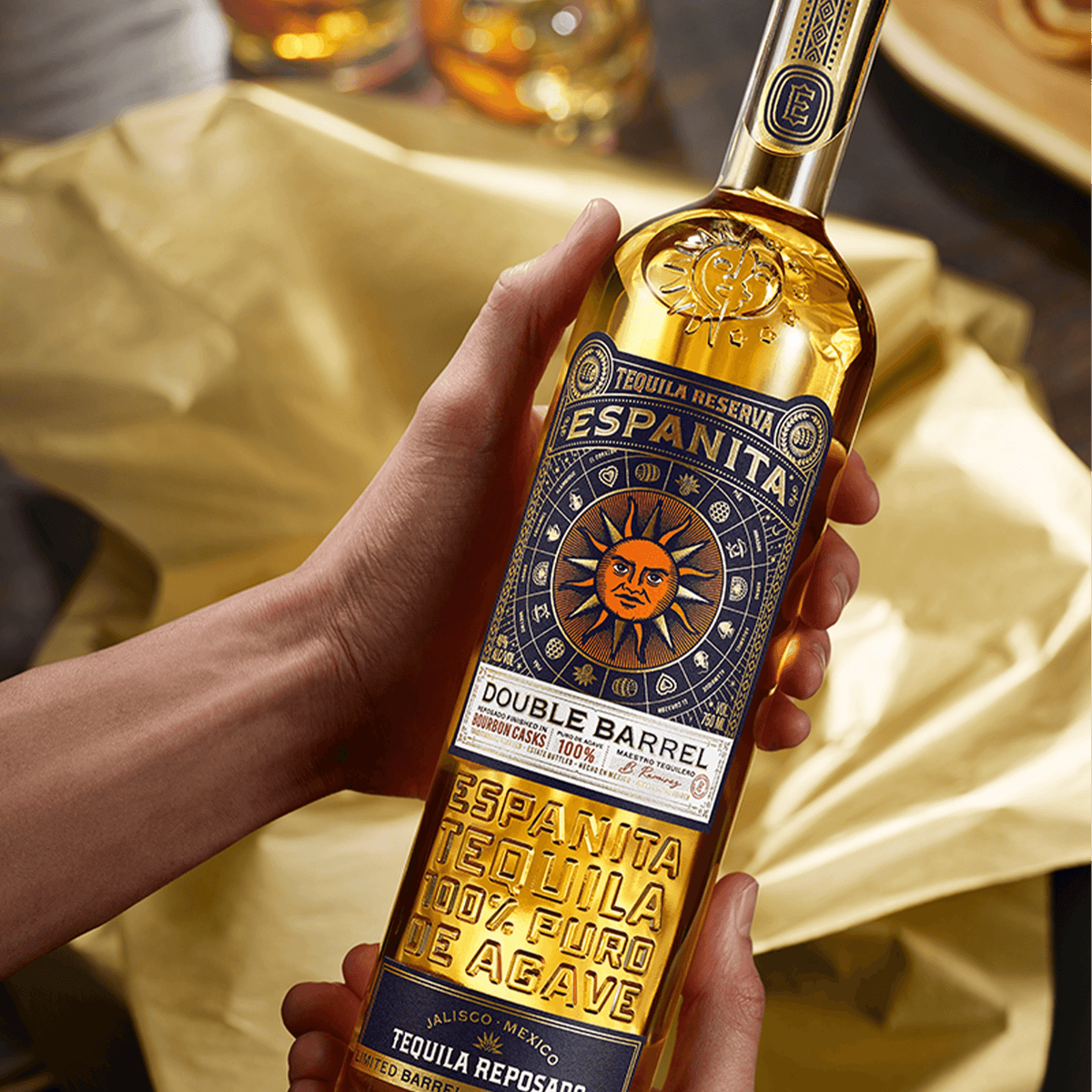 Espanita Double Barrel Reposado Tequila bottle showcasing unique aging and vibrant labeling on a textured background.
