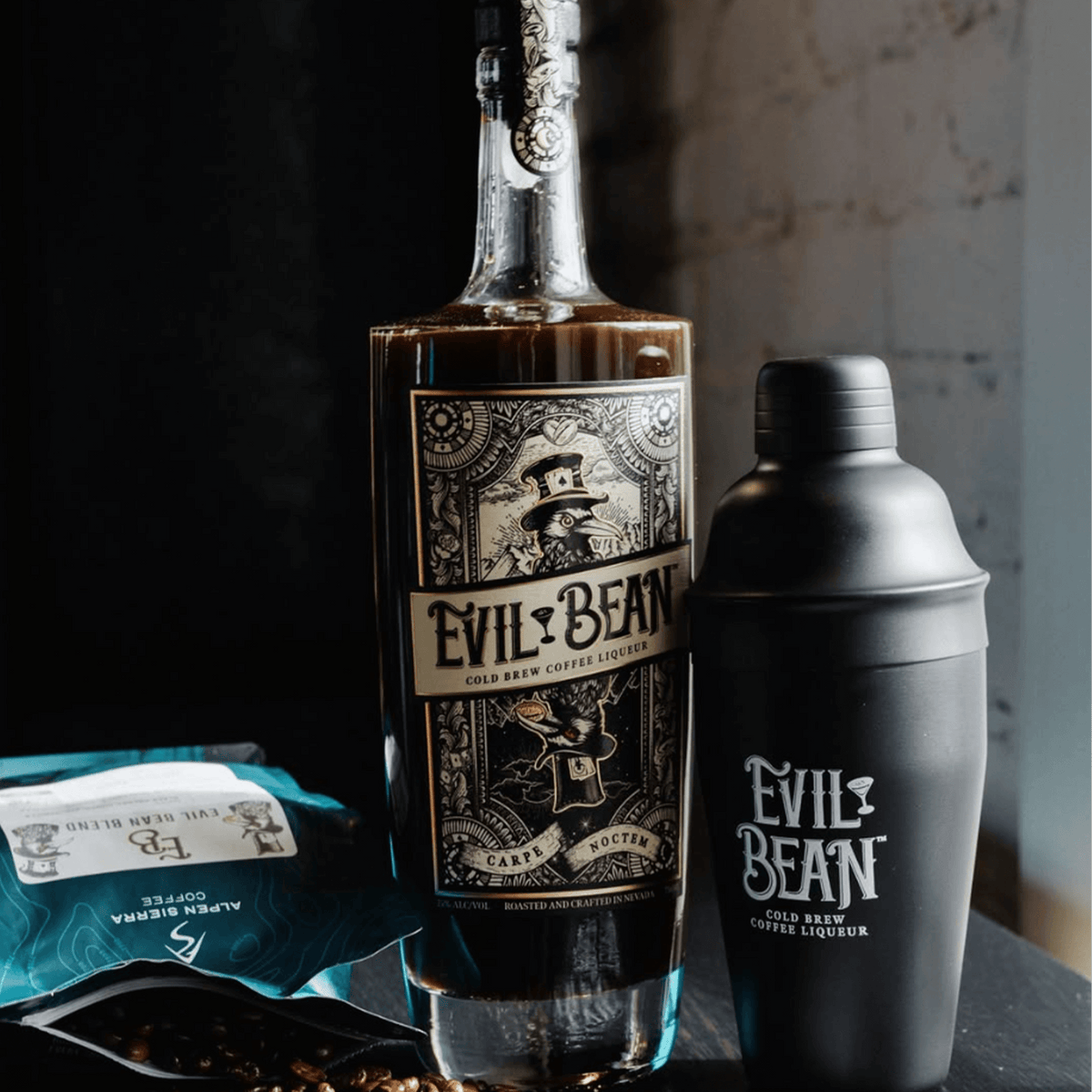 Evil Bean Cold Brew Coffee Liqueur bottle and shaker with coffee beans for crafting cocktails.