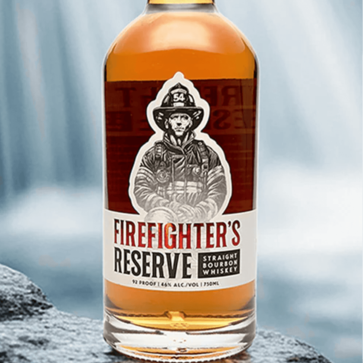 Firefighter's Reserve Straight Bourbon Whiskey bottle featuring a firefighter illustration, 92 proof, in front of a waterfall.