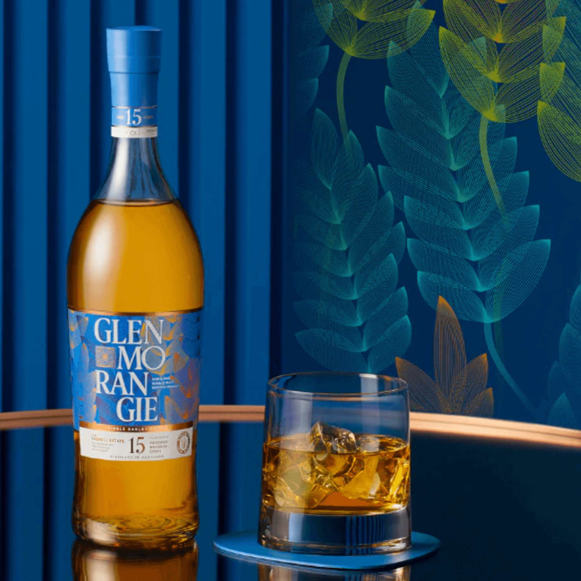 Glenmorangie 15 Year Cadboll Estate Batch 4 whisky bottle with a glass of whisky on a stylish backdrop.