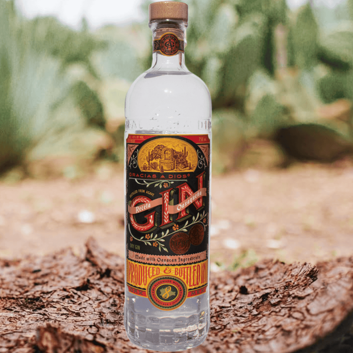 Gracias A Dios Oaxacan Recipe Gin bottle featuring local ingredients and agave, set against a rustic natural backdrop.