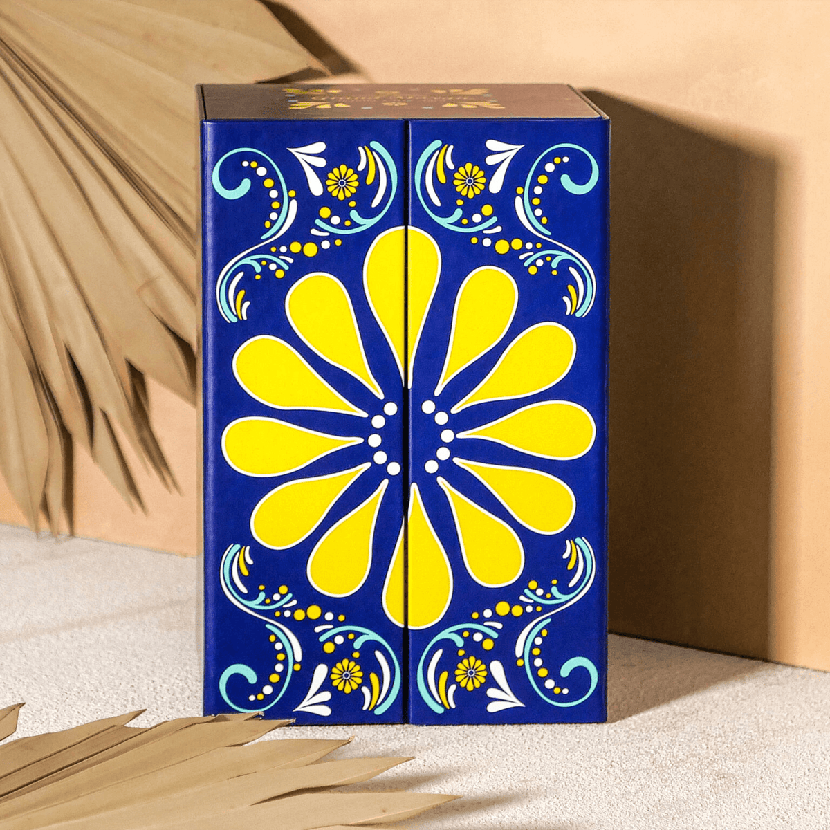Grand Mayan Limited Edition Tequila decorative packaging in vibrant blue and yellow floral design.