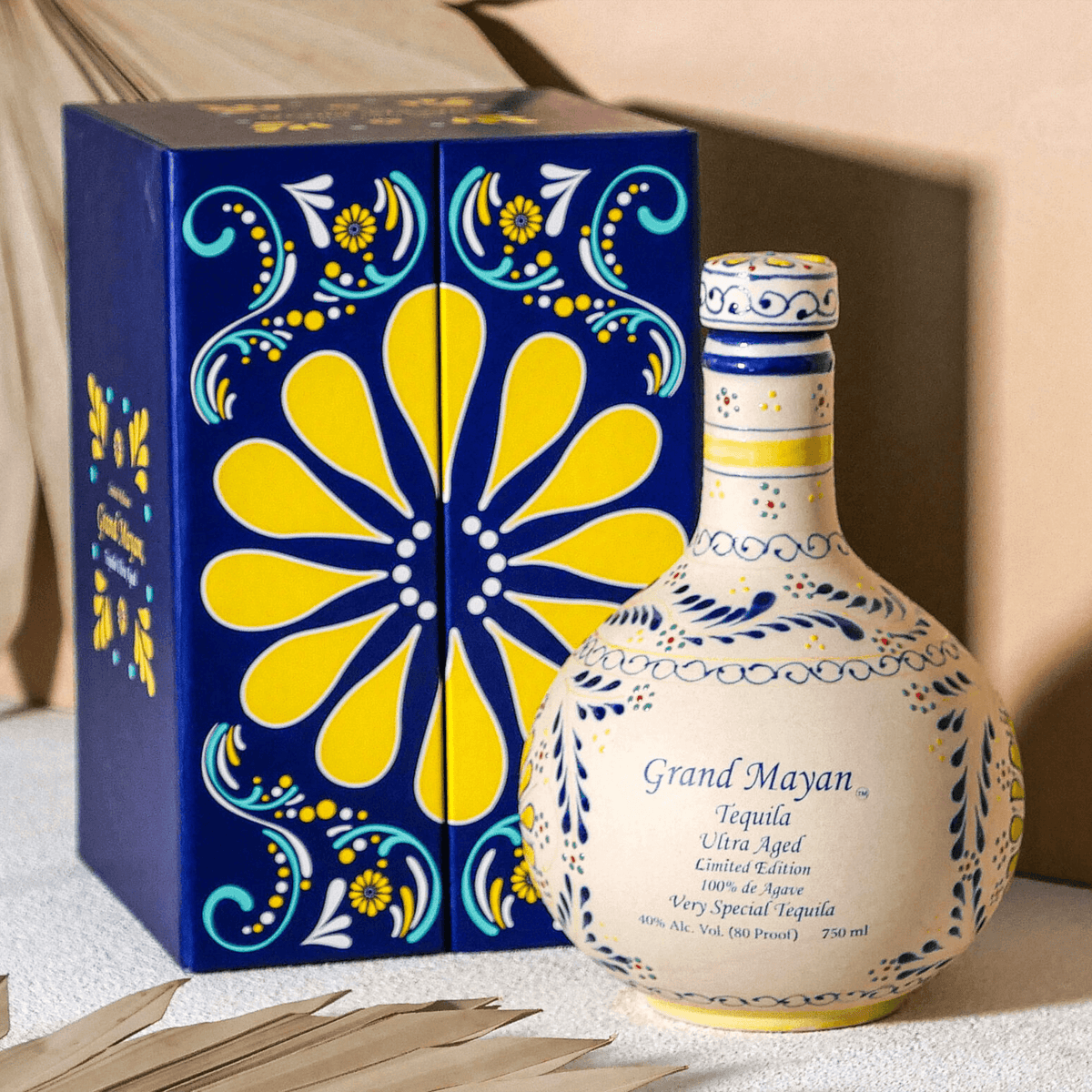 Grand Mayan Limited Edition Ultra Añejo Tequila bottle with colorful packaging on display.