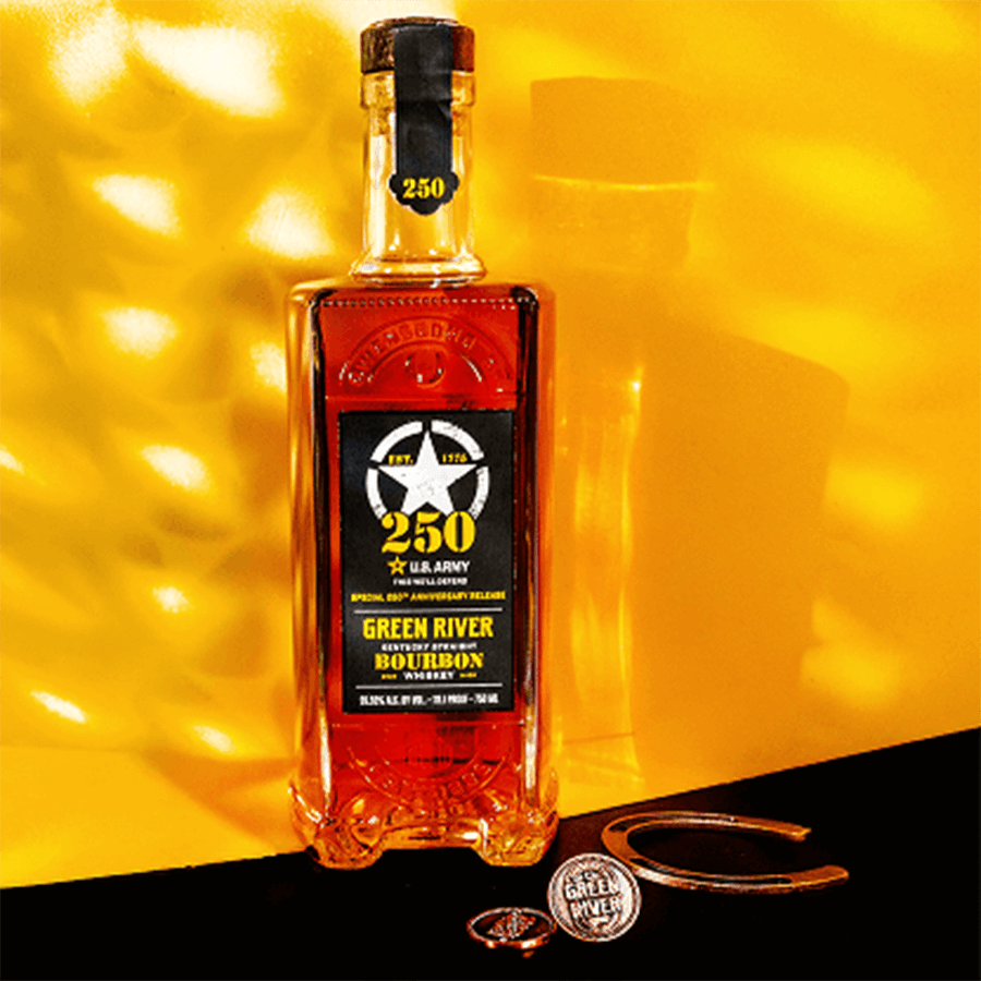 Green River US Army 250th Anniversary Kentucky Straight Bourbon bottle with commemorative items on a yellow background.