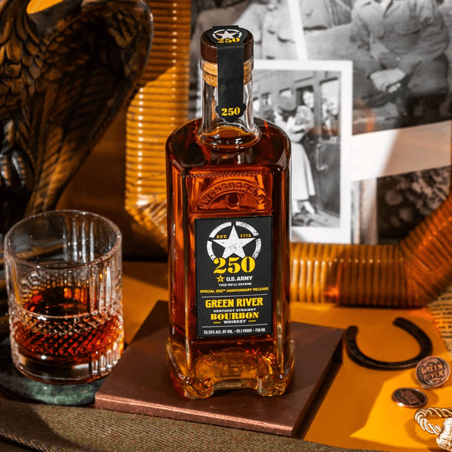 Green River US Army 250th Anniversary Bourbon bottle on display with glass and historical photos.