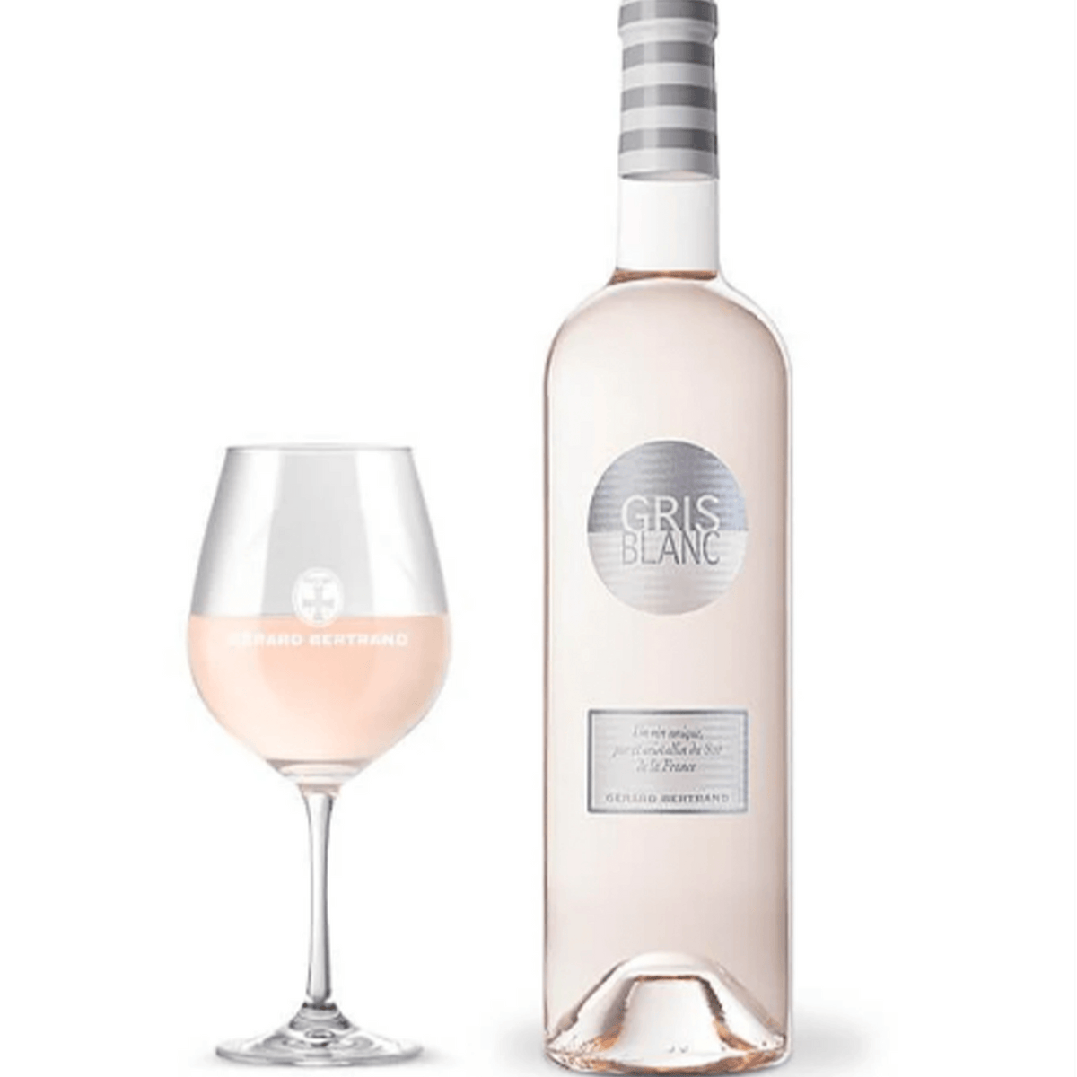 Bottle of Gris Blanc Rosé wine with a glass, showcasing its pale pink color and elegant presentation.