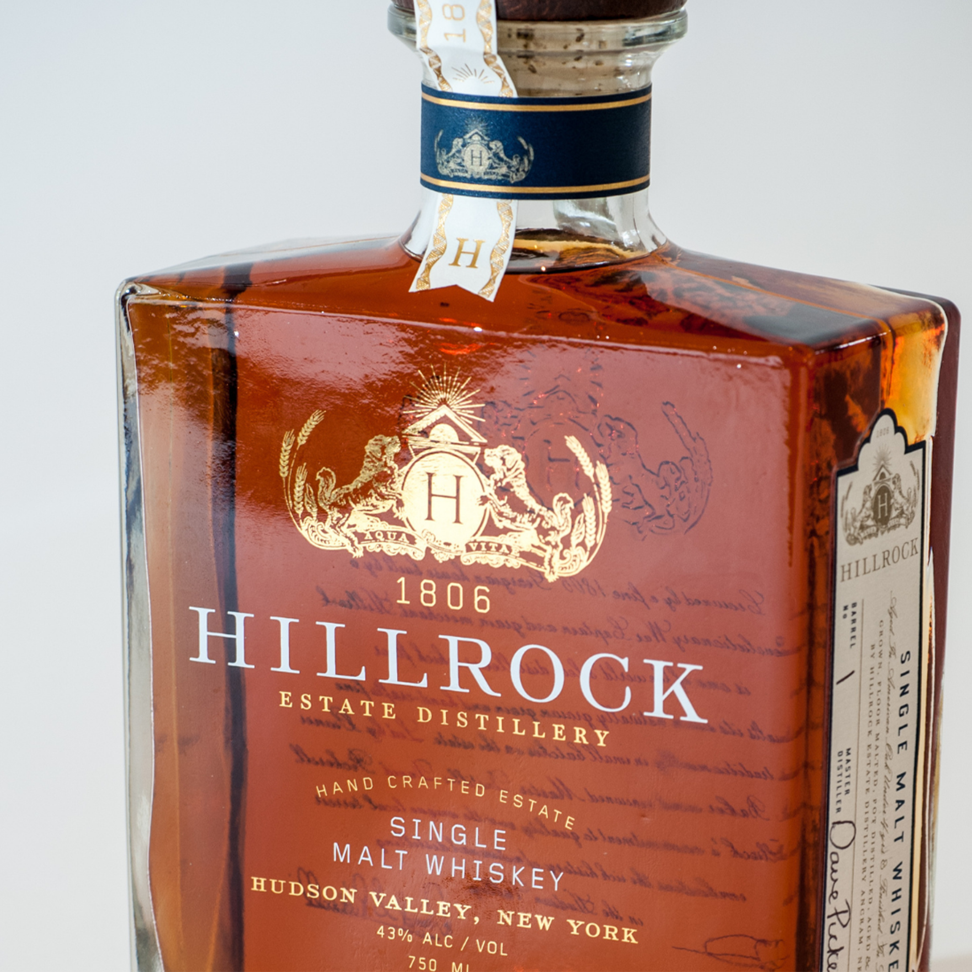 Hillrock Single Malt OPX Whiskey bottle showcasing intricate label and craftsmanship, distilled in Hudson Valley, New York.