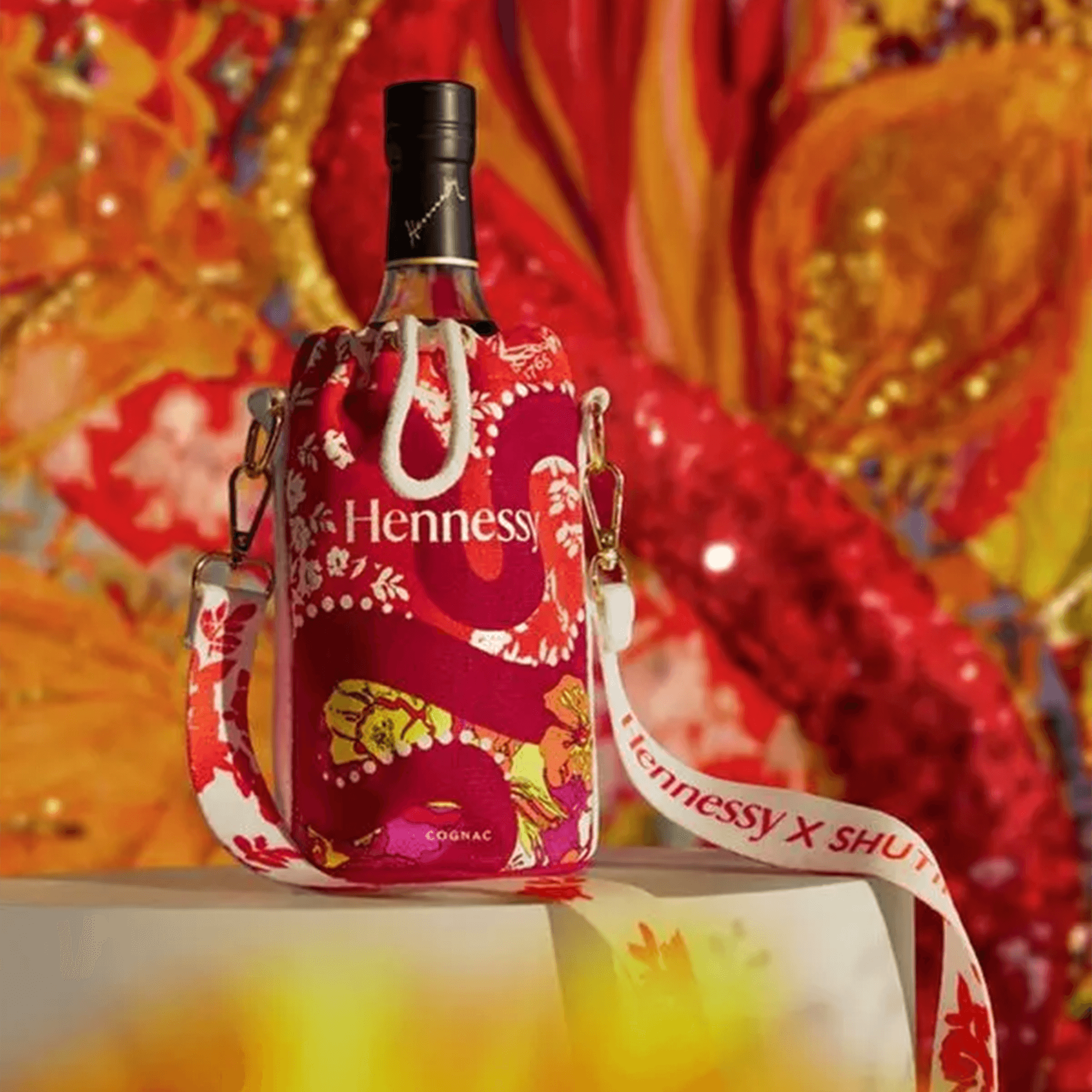 Hennessy VSOP Lunar New Year 2025 bottle in a vibrant red and floral bag by Shuting Qiu, celebrating the Year of the Snake.