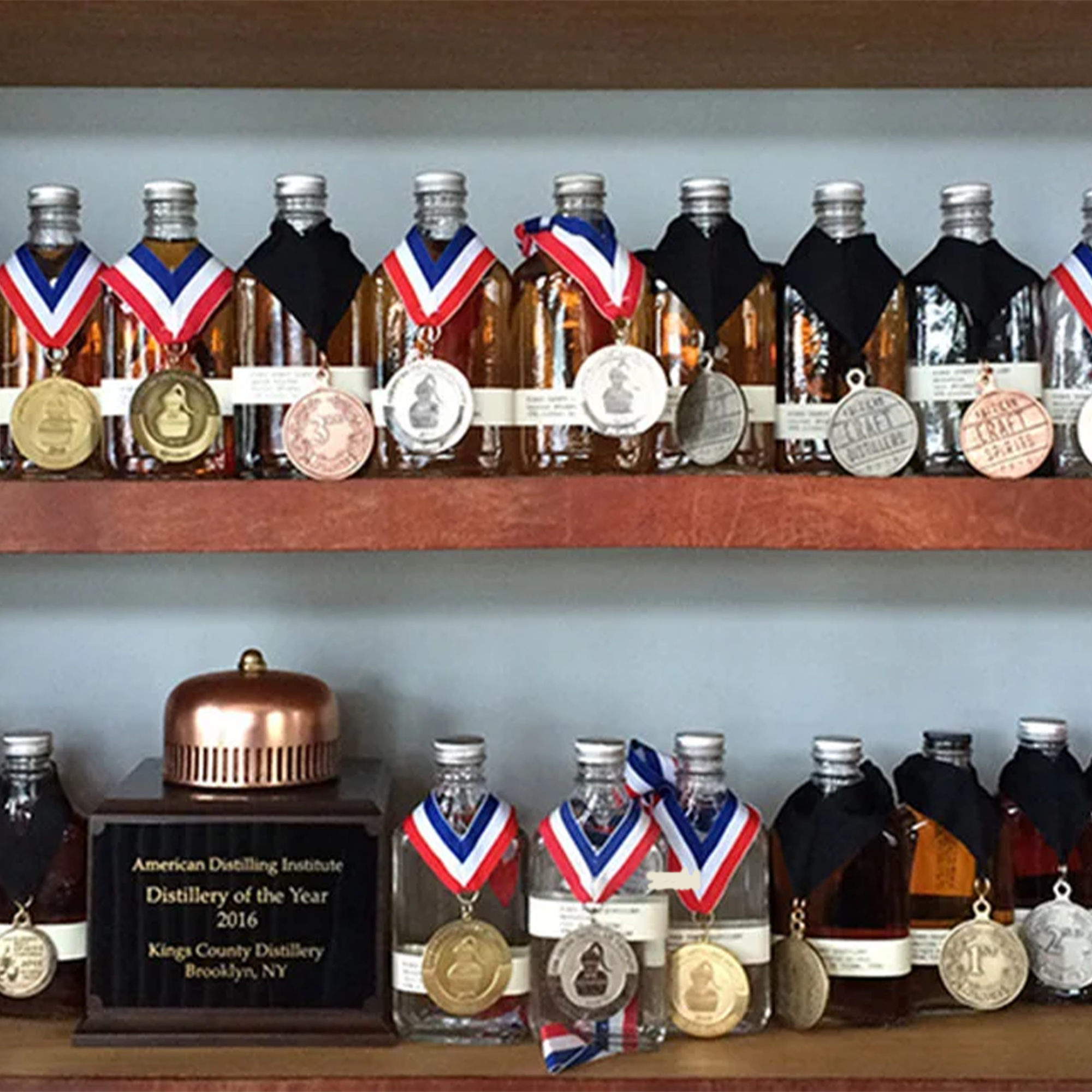 Collection of King's County Distillery bottles featuring medals and awards highlighting quality craftsmanship.