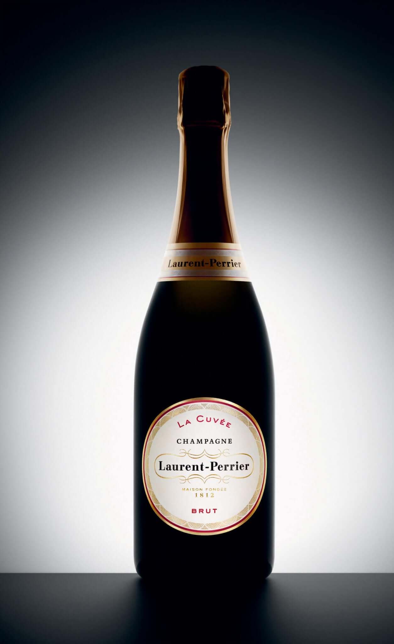 Laurent Perrier La Cuvée Brut Champagne bottle showcasing elegance and finesse against a dramatic background.