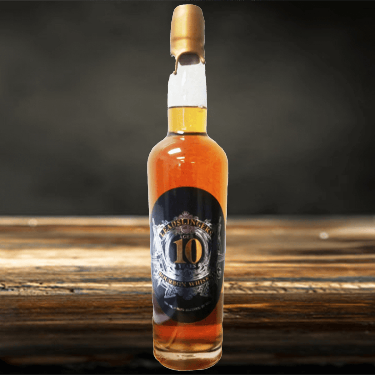 Leadslingers 10 Year Bourbon Whiskey bottle showcasing its rich amber color and elegant label on a rustic wooden surface.