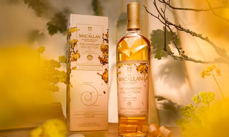 Macallan Harmony Collection Vibrant Oak Single Malt Scotch displayed with packaging and floral backdrop.