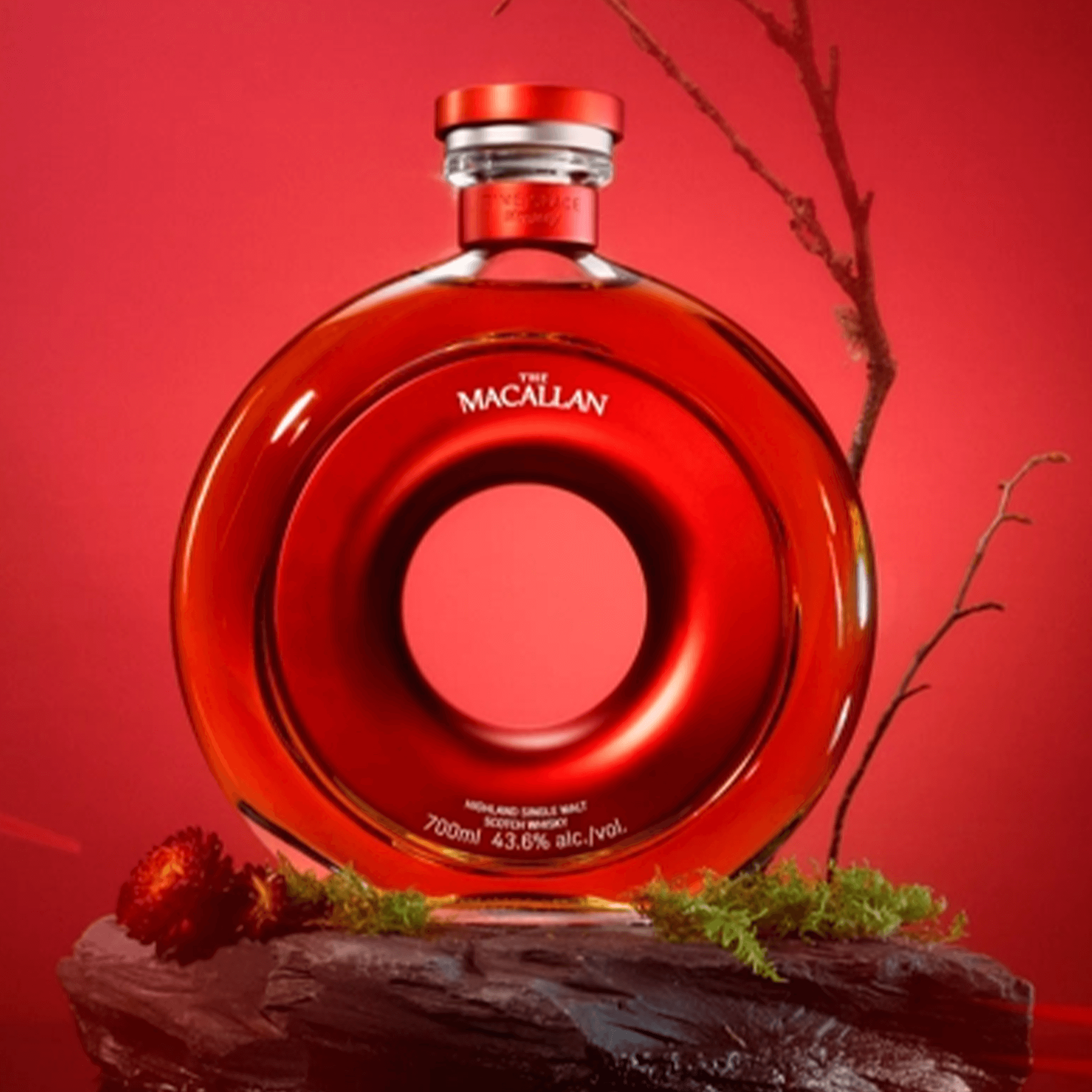 Macallan Time Space Mastery Single Malt Scotch Whisky 700ml in a circular red bottle with natural decor.