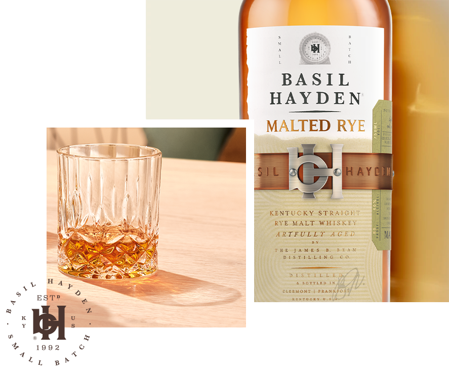 Basil Hayden Malted Rye whiskey bottle alongside a glass of whiskey on a wooden table, showcasing its unique elegance.