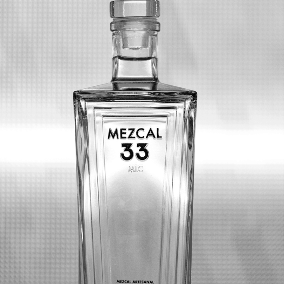 Mezcal 33 Joven Espadin bottle showcasing premium artisanal craftsmanship.