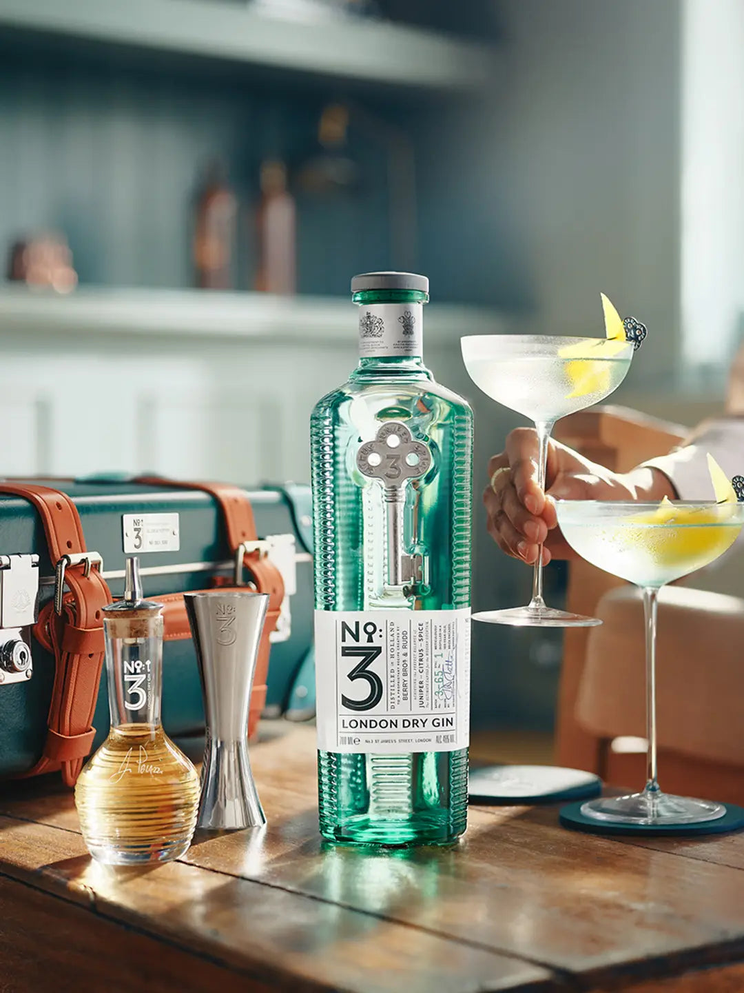 No 3 London Dry Gin with cocktail shaker and two martini glasses, showcasing luxury and craftsmanship.