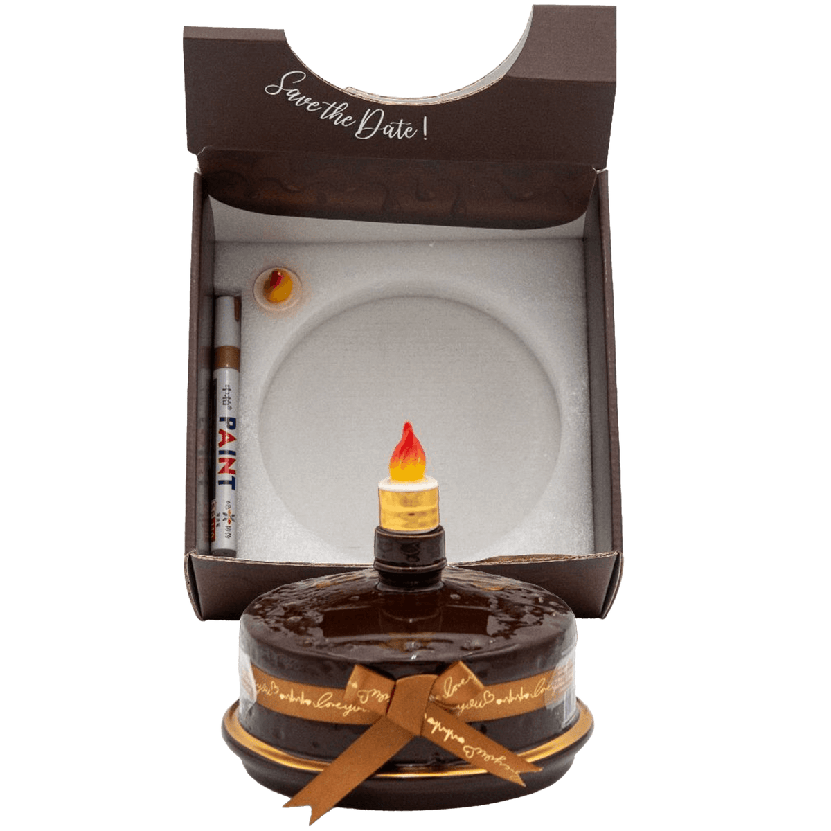 Oceano Azul Round Chocolate La Cake Añejo Tequila in a festive box with a decorative candle and save the date message.