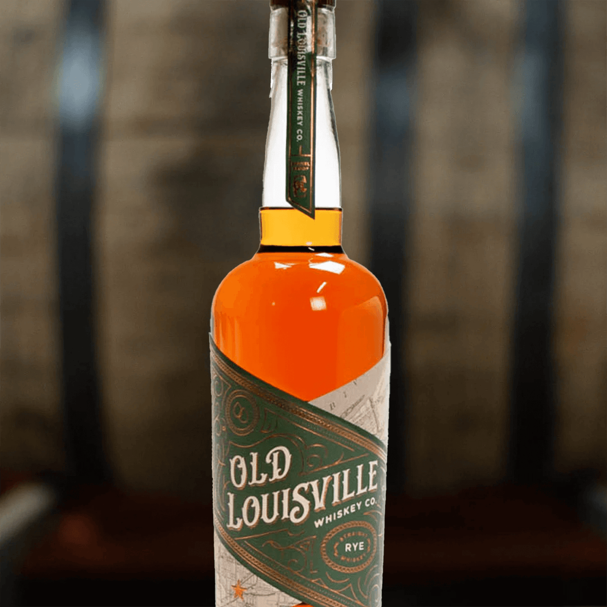 Old Louisville Straight Rye Single Barrel 8 Year Whiskey bottle, showcasing rich amber color and elegant label design.