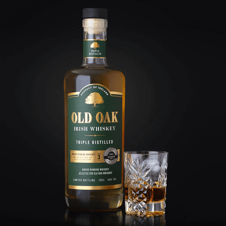 Old Oak Irish Whiskey 700ml bottle with glass, triple distilled, aged 3 years, showcasing premium craft and tradition.