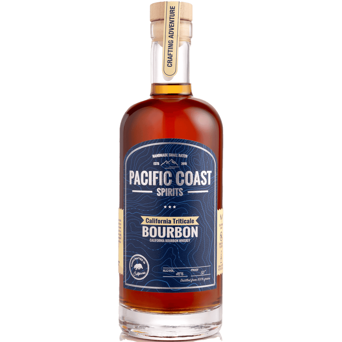 Pacific Coast Triticale Bourbon Whiskey bottle featuring a rich amber color and elegant label design.