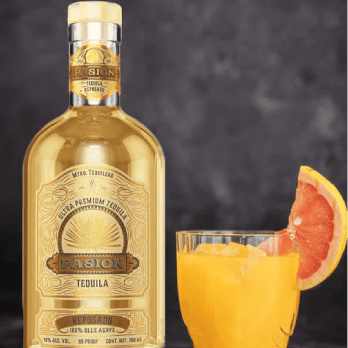 Bottle of Pasión Reposado Tequila 700ml with a cocktail garnished with a slice of grapefruit.