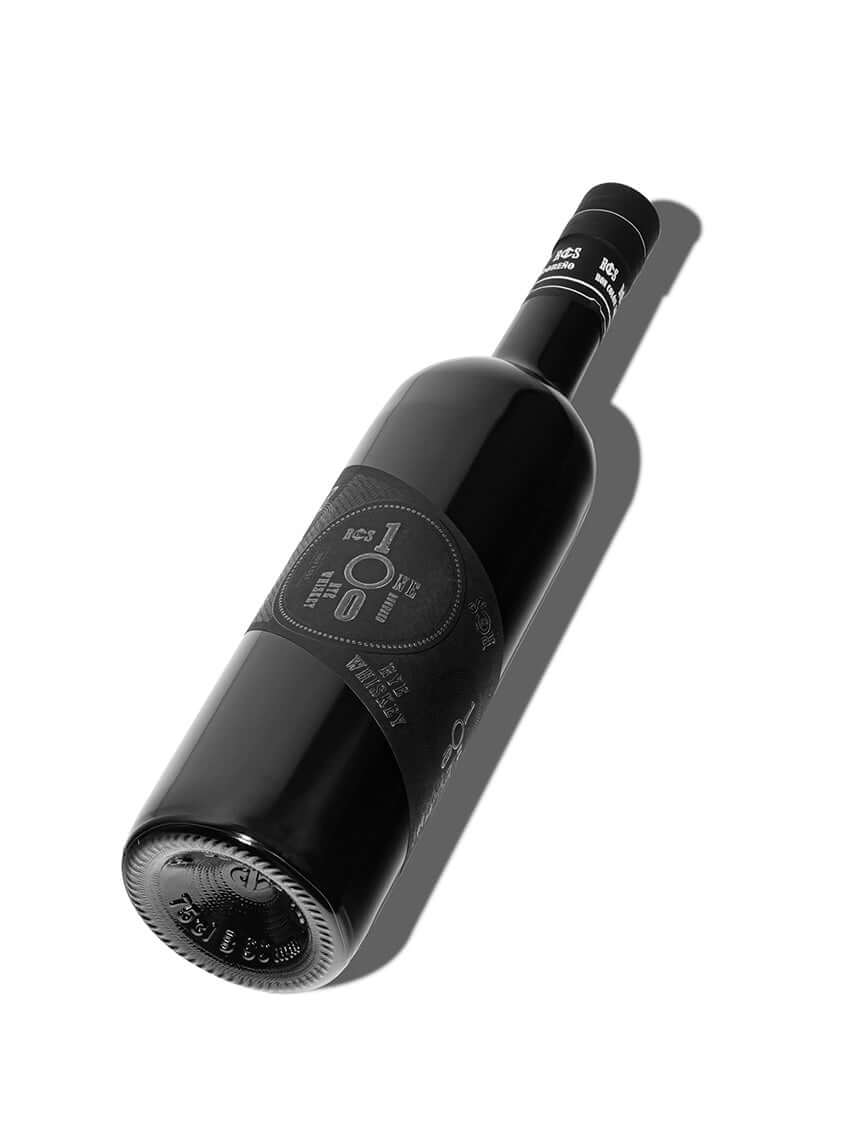 Ron Colón Salvadoreño American Rye Whiskey bottle showcasing its sleek design and rich black label.