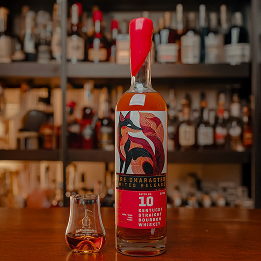 Rare Character Kentucky Straight Bourbon Batch No. 10 bottle with tasting glass on bar background.