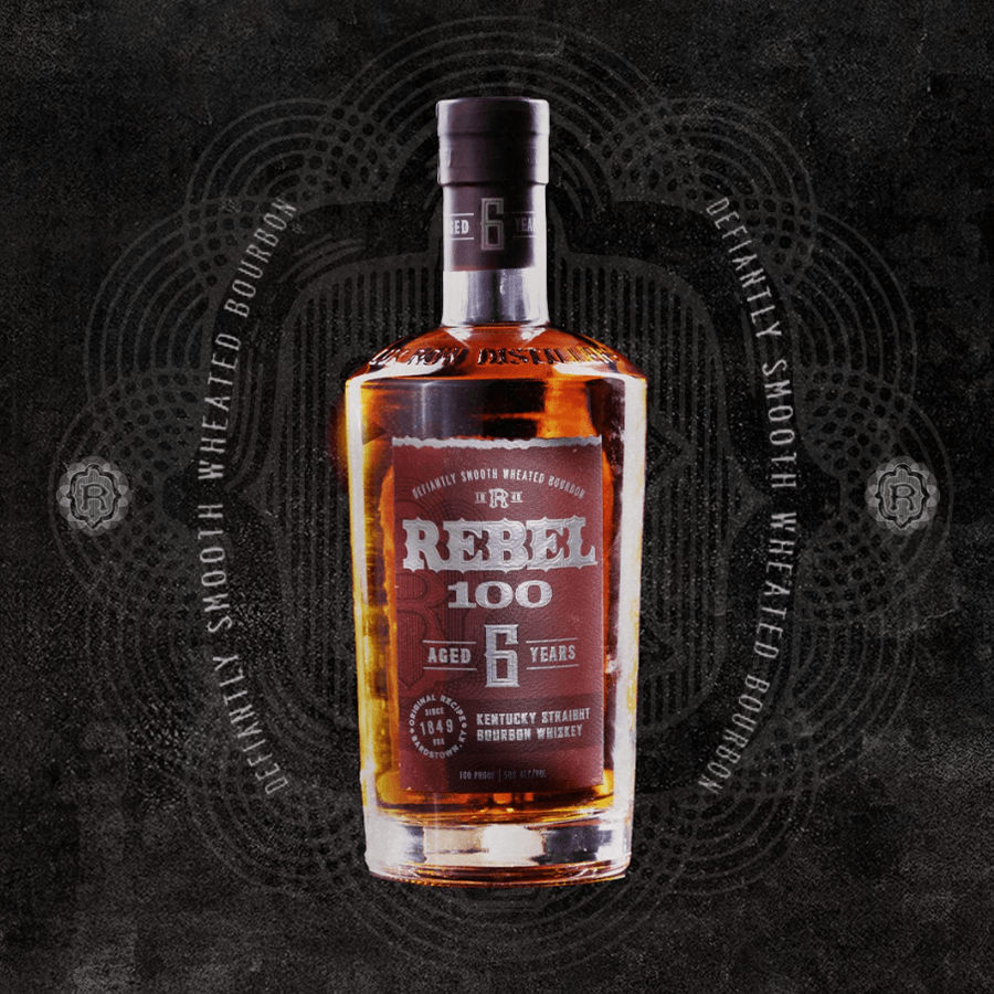 Bottle of Rebel 100 6 Year Kentucky Straight Bourbon Whiskey on a decorative background.