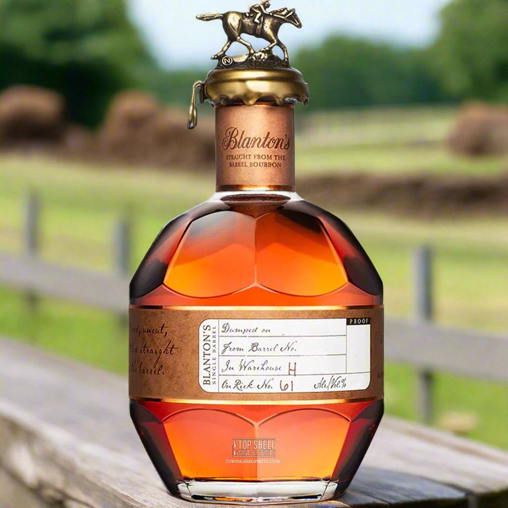 Blanton’s Straight From The Barrel Bourbon bottle with equestrian figure in outdoor setting.