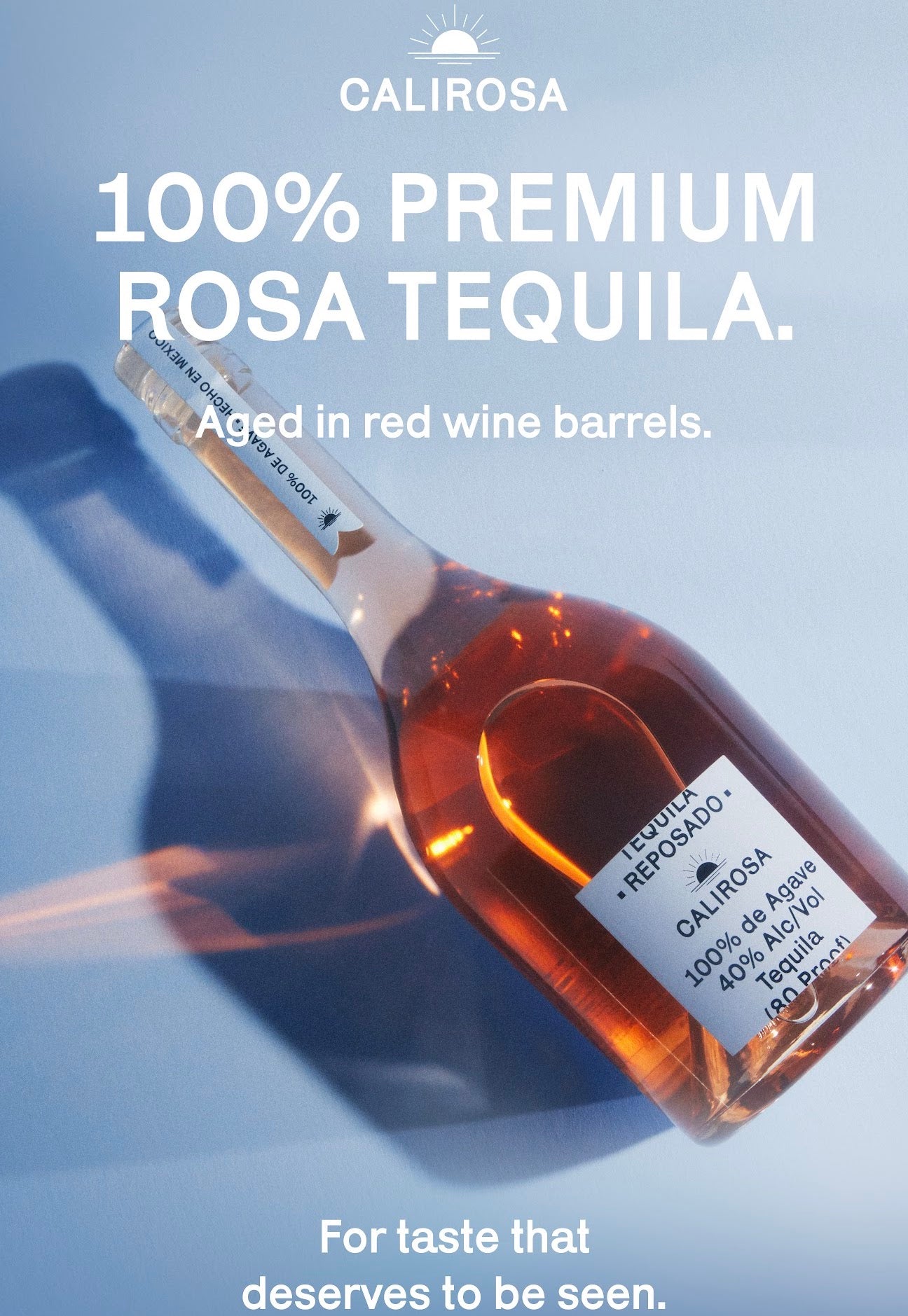 Bottle of Calirosa Reposado Tequila, aged in red wine barrels, showcasing premium rosa hue.