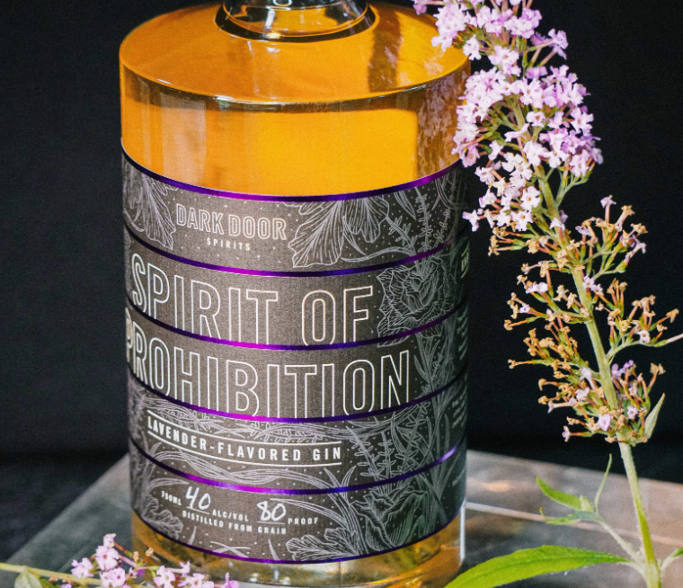 Dark Door Spirits Spirit of Prohibition Gin bottle with lavender aroma, showcasing honey color and smooth flavor profile.